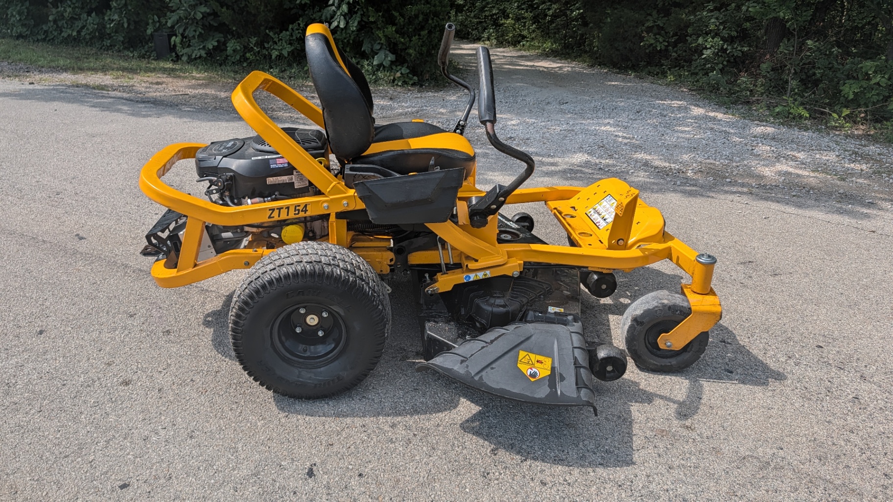 Yellow Cub Cadet ZT1 54 zero-turn mower on the drive