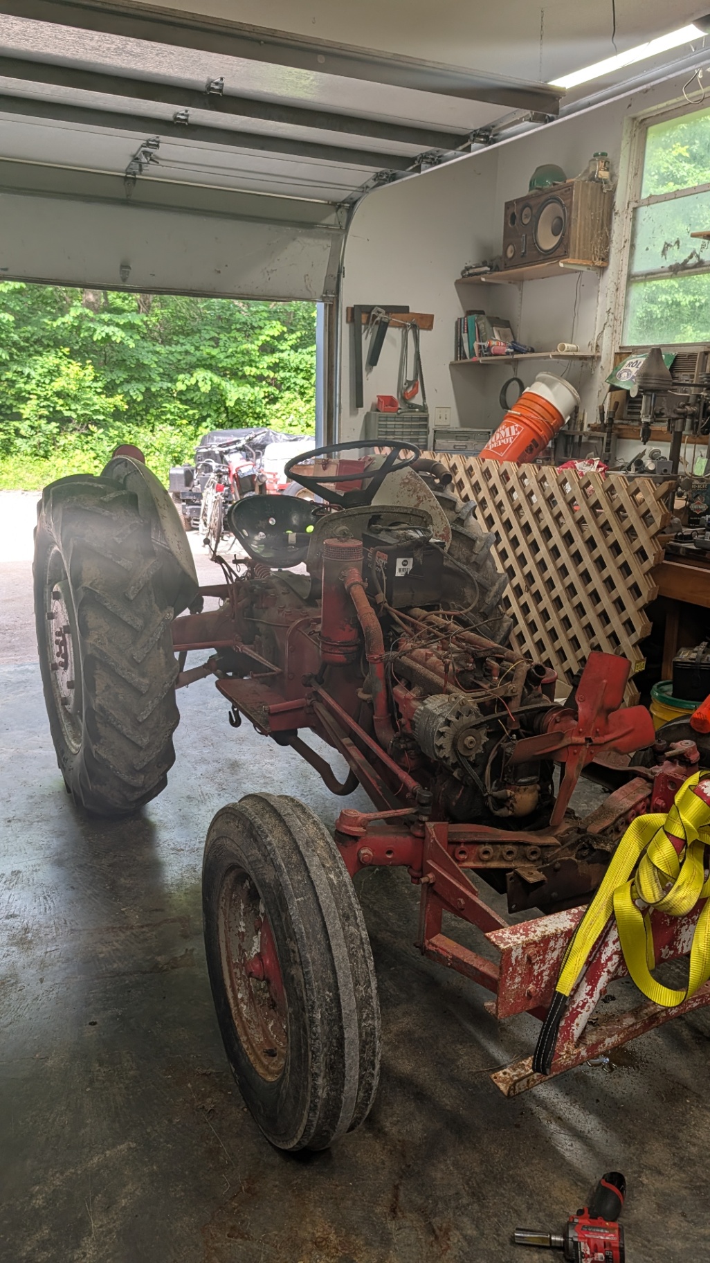 Antique Ford tractor in the shop during a full mechanical rebuild