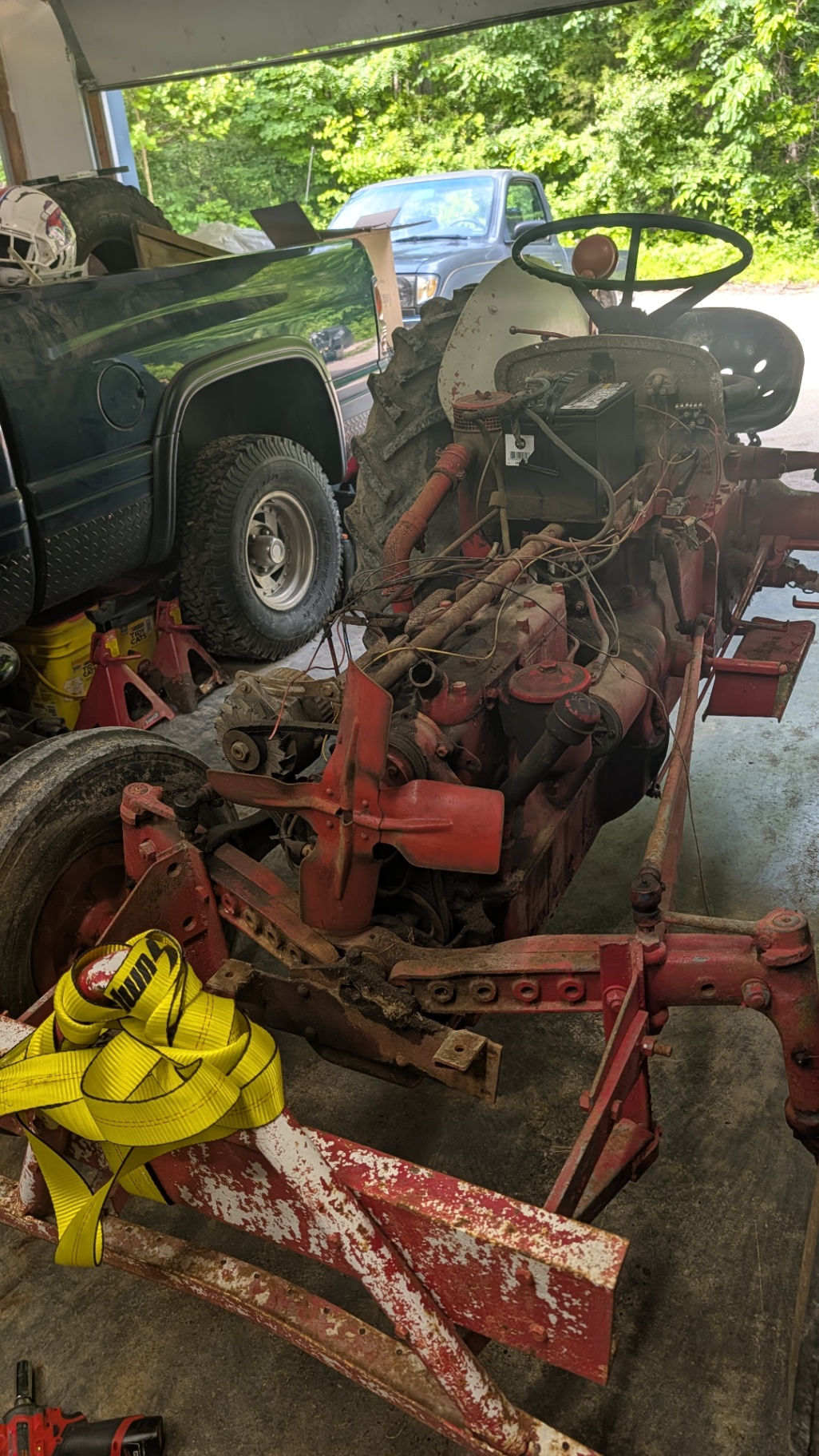 Ford tractor engine and wiring exposed during teardown