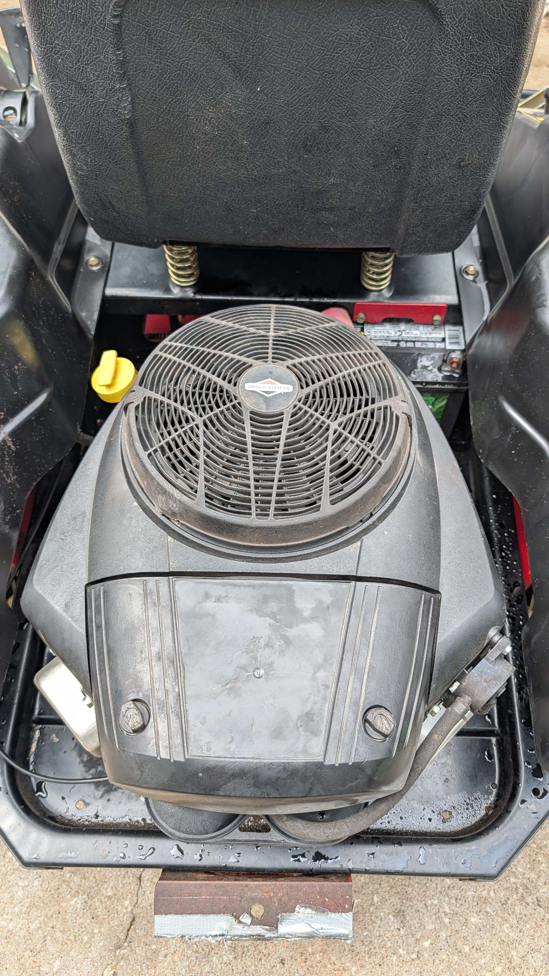 Briggs & Stratton engine under a zero-turn mower seat